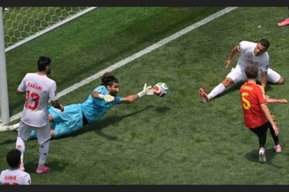 FIFA World Cup 2026, Alireza Beiranvand, Beiranvand save vs Belgium, Iran vs Belgium World Cup 2026, FIFA World Cup Moment of the Day, Iran football team, World Cup 2026 highlights, Kevin De Bruyne, Romelu Lukaku, Maxim De Cuyper, Iran unbeaten World Cup 2026, Best World Cup saves, Save of the tournament, FIFA World Cup news, Iran knockout qualification, Beiranvand World Cup heroics, World Cup goalkeeping moments, Belgium vs Iran draw, ESPN India World Cup, Football World Cup 2026 news,