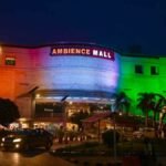 Ambience Mall decorated in Indian tricolour for 80th Independence Day celebrations, featuring the Eternal Flame of Valour installation.